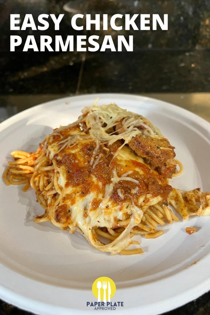 baked spaghetti with chicken parmesan on a paper plate