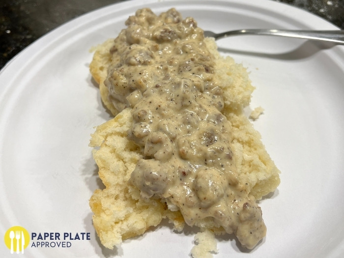 biscuits and gravy on a paper plate