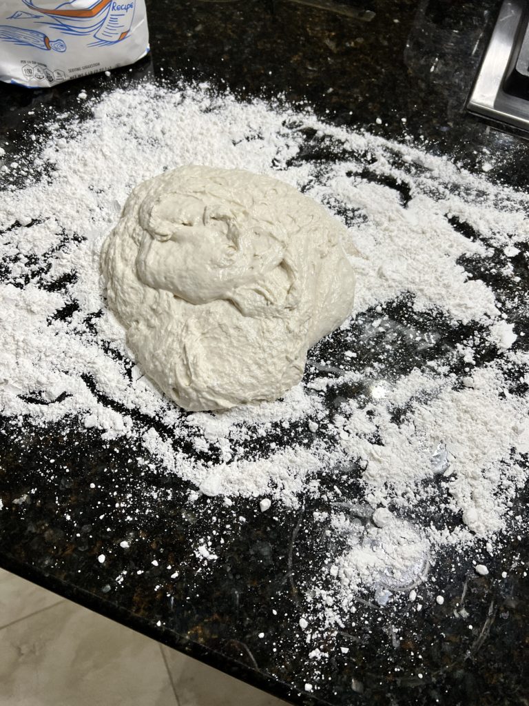 dough on a black countertop